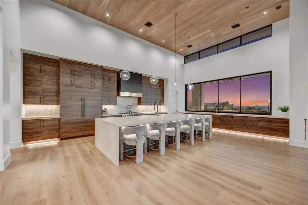 Chef's kitchen with custom cabinetry and stone counters