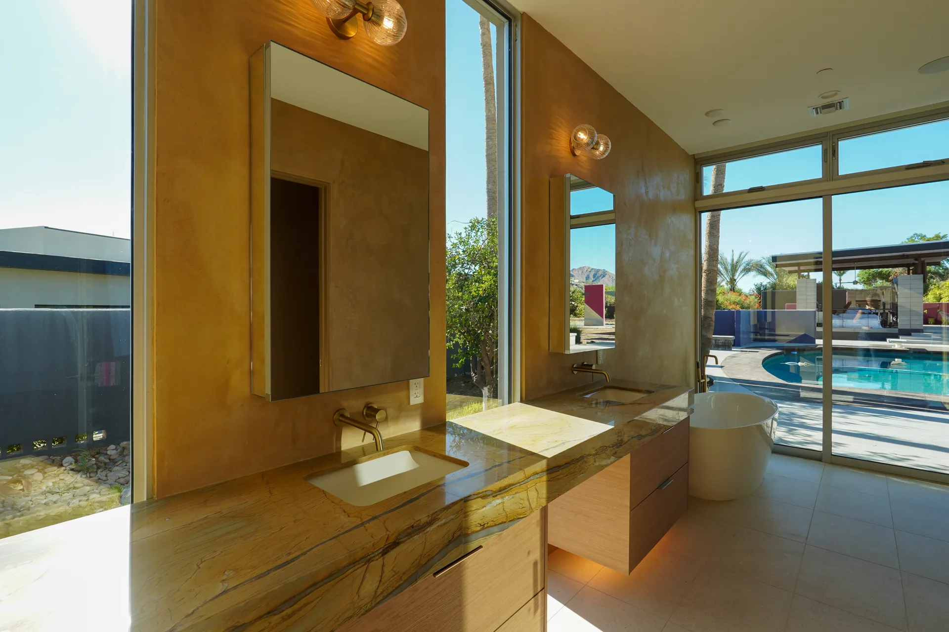 Primary vanity with views out to the pool
