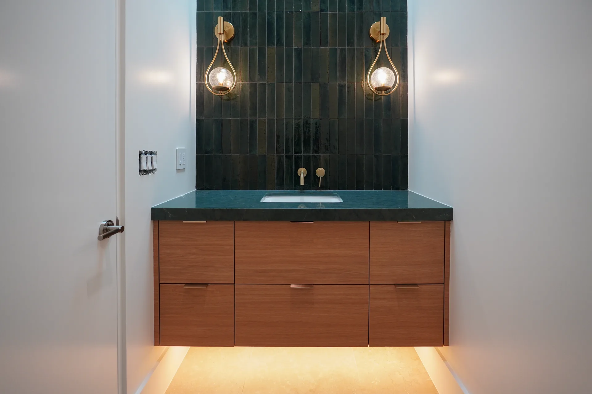 Floating vanity with under-cabinet lighting in the powder room