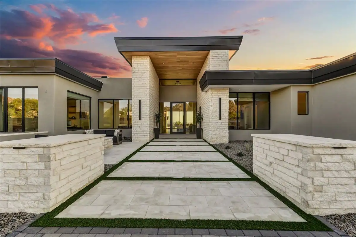 Front entry illuminated at sunset